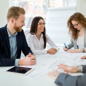 Cheerful coworkers in office during company meeting
